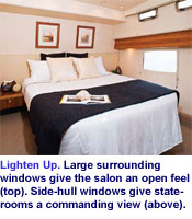 Lighten Up. Large surrounding windows give the salon an open feel (top). Side-hull windows give staterooms a commanding view (above).